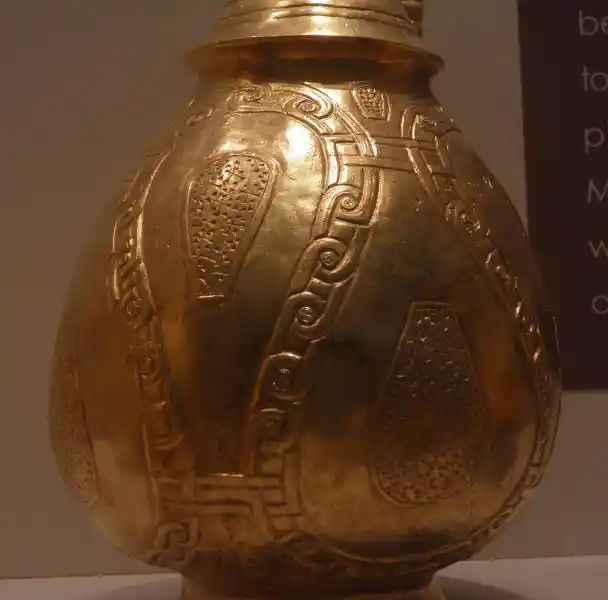 Cross design on a gold vessel